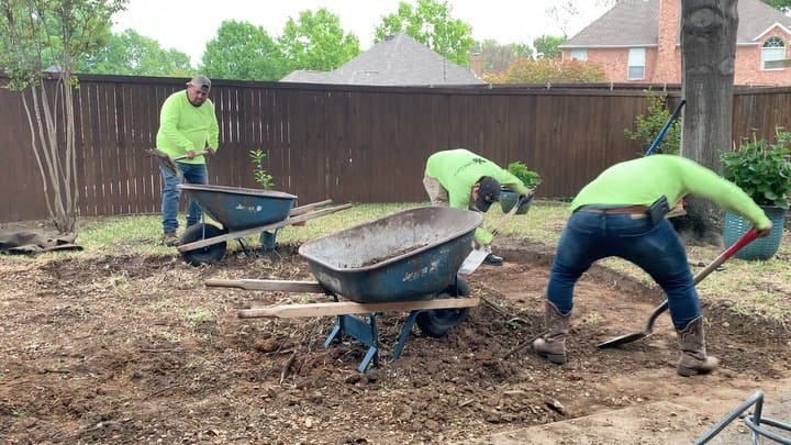 Crew preparing backyard landscape