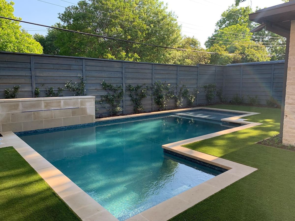 Poolside artificial turf landscape