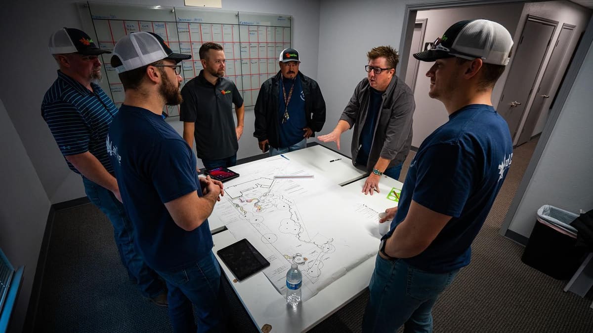 Team reviewing landscape plans