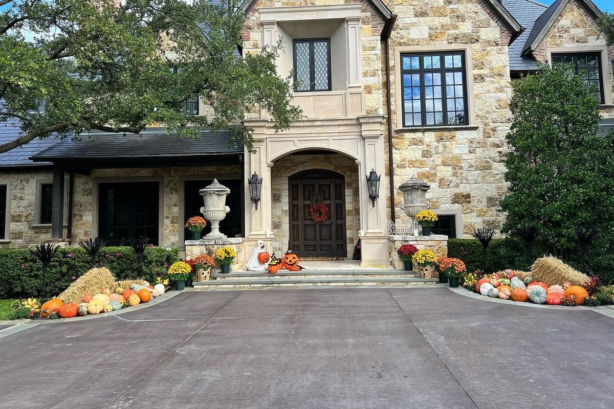 Corporate campus courtyard with clean landscape beds and mature shade trees in Coppell, TX
