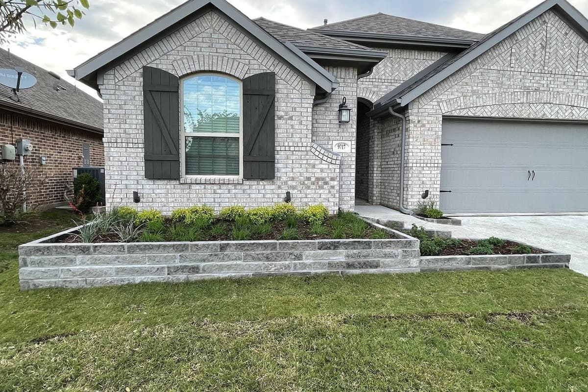 Modern mixed-use commercial development with fresh landscaping and young trees in Frisco, TX