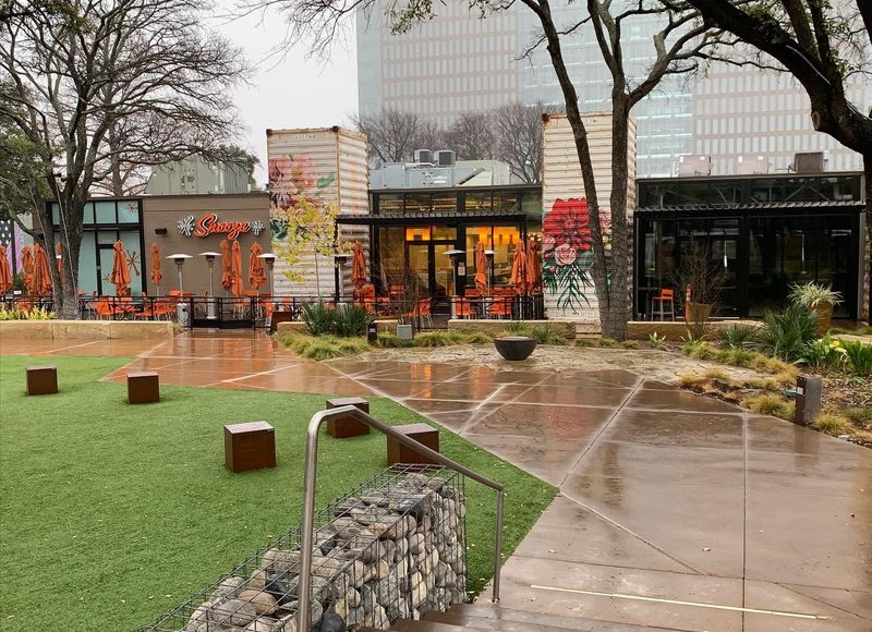 Commercial plaza hardscape with stone walls, walkways, and seating