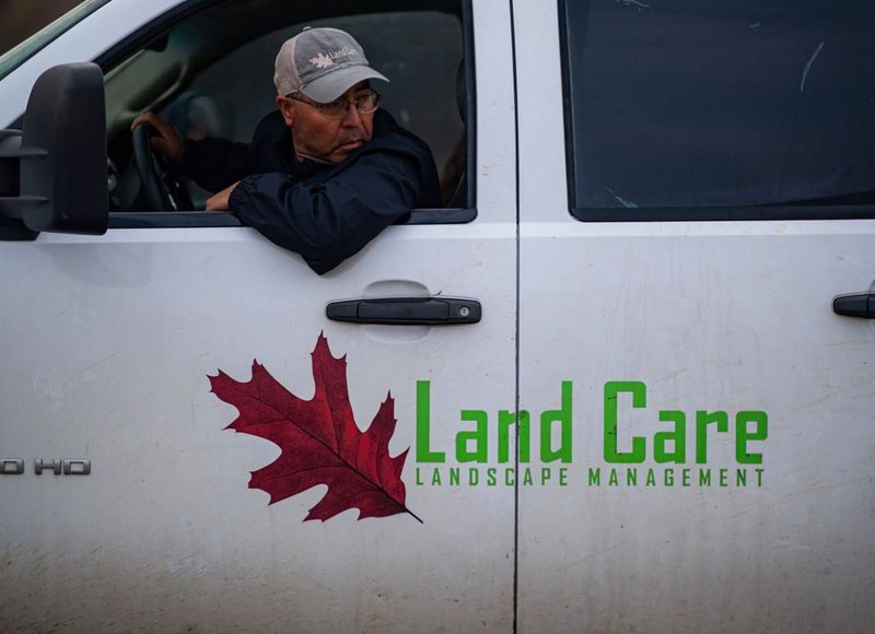 Land Care service truck with company branding, ready to respond to winter weather